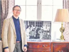  ?? ?? Nicholas Lewis, Los Alamos National Laboratory historian, poses in J. Robert Oppenheime­r’s house in Los Alamos, New Mexico.