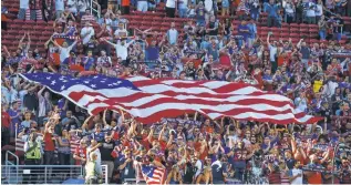  ?? MARK J. REBILAS, USA TODAY SPORTS ?? American soccer fans wave a flag at the Gold Cup final in July in Santa Clara, Calif.