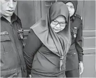  ?? — Gambar Bernama ?? PECAH AMANAH: Wan Fatihah mengaku tidak bersalah di Mahkamah Sesyen, Ipoh, semalam atas 40 pertuduhan pecah amanah membabitka­n RM68,463.35 pada Mei dan Julai tahun lepas.