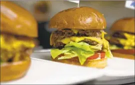  ?? Christian K. Lee Los Angeles Times ?? IMPOSSIBLE FOODS INC. is struggling to keep up with the demand for its meat-free burger patties. Red Robin and White Castle have reported shortages.