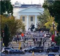  ?? Associated Press ?? ■ The White House is seen in Washington early Tuesday morning after President Donald Trump returned from the hospital where he was treated for COVID-19.