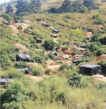  ?? ?? Some of the makeshift mines set around Redwing processing plant in Penhalonga