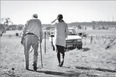  ?? PHOTO: RYAN BARWOOD ?? ‘Pop’ with Bethany, in the paddocks on his property.