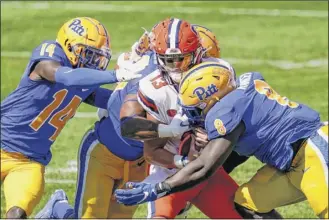  ?? Keith Srakocic / Associated Press ?? Syracuse quarterbac­k Tommy Devito (13) endures one of seven sacks by the Pitt defense on Saturday. The Orange have allowed 14 sacks in their first two games.