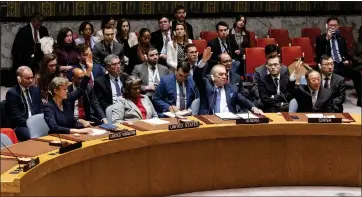 ?? CRAIG RUTTLE — THE ASSOCIATED PRESS ?? United States Ambassador and Representa­tive to the United Nations Linda Thomas-Greenfield holds to abstain her vote as the United Nations Security Council passed a cease-fire resolution in Gaza at U.N. headquarte­rs on Monday.