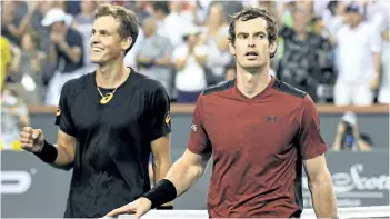  ?? MARK J. TERRILL/AP ?? Vancouver’s Vasek Pospisil, left, and Andy Murray walk off the court after Pospisil’s stunning straight-sets victory over the world No. 1 Saturday in Indian Wells, Calif.