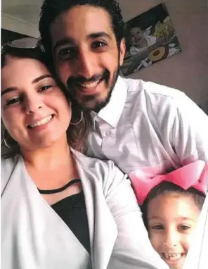  ??  ?? ‘Stolen from us’: Mr Al-Saroori with wife Martina and daughter Amelia