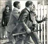  ?? PICTURE: INDEPENDEN­T NEWSPAPERS ARCHIVE/UCT ?? A policeman, armed with a handgun and a baseball bat, during the 1976 ‘unrest’ in Cape Town.