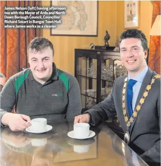  ??  ?? James Nelson (left) having afternoon tea with the Mayor of Ards and North Down Borough Council, Councillor Richard Smart in Bangor Town Hall where James works as a cleaner