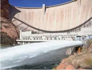  ??  ?? Water is released from Glen Canyon Dam.