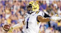  ?? GERALD HERBERT/AP ?? LSU receiver Ja’Marr Chase celebrates a touchdown reception against Texas A&M in 2019.