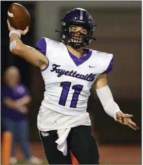  ?? (Special to NWA Democrat Gazette/Brian Sanderford) ?? Bladen Fike of Fayettevil­le was 21-of-26 passing for 270 yards and 5 touchdowns in a 42-14 victory over Rogers Heritage on Friday.