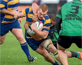  ?? PHOTO: VIRGINIA WOOLF/FAIRFAX NZ ?? Marist flanker Te Puoho Stephens tackles Wanderers’ Steve Soper during Saturday’s Nelson Bays division one rugby final at Trafalgar Park.