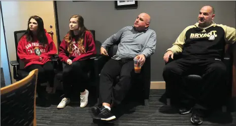  ?? Photo by Ernest A. Brown ?? Bryant assistant football coaches Vinny Marino (second from right) and Eddy Morrissey (right) listen to one of Bryant’s Think Tank members talk Thursday. The Think Tank is made up of four students, including Molly Healy (left) and Bridget Healy (second...