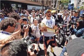  ?? CARY EDMONDSON/USA TODAY SPORTS ?? Among the many summer adventures Steph Curry has already experience­d was cradling the Larry O’Brien Championsh­ip Trophy during the Warriors’ 2018 championsh­ip victory parade in downtown Oakland.