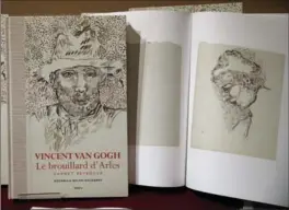  ?? CHRISTOPHE ENA, THE ASSOCIATED PRESS ?? Copies of the book titled “Vincent Van Gogh The lost Arles Sketchbook” are displayed during a press conference held in Paris.