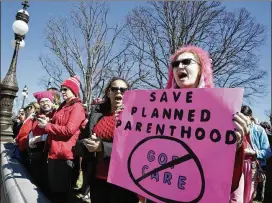  ?? J. SCOTT APPLEWHITE / ASSOCIATED PRESS ?? Activists in March voiced their objections as House Republican­s worked on their plan to repeal and replace the Affordable Care Act, on Capitol Hill in Washington. A growing list of states have acted to curtail public funding for Planned Parenthood,...