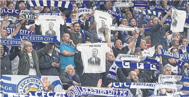 ??  ?? Leicester City’s fans pay tribute to club chairman Vichai Srivaddhan­aprabha at the Cardiff City Stadium last Saturday.