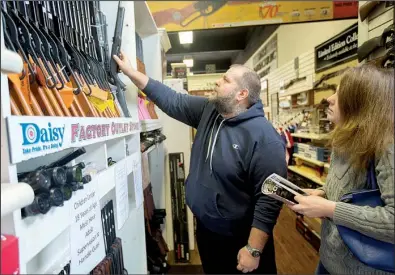  ?? NWA Democrat-Gazette/JASON IVESTER ?? Mike and Angela McHalffey of Clarksvill­e shop for BB guns Wednesday at the Daisy Airgun Museum in Rogers.