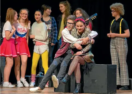  ?? PHOTO: MYTCHALL BRANSGROVE/FAIRFAX NZ ?? Timaru Girls’ High and Timaru Boys’ High school students rehearse for their joint production Back to the 80’s. Pictured at front are Caleb Cameron and Jessie Goodsir.