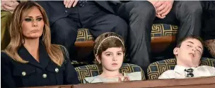  ?? AFP ?? Melania Trump with Grace Eline and Joshua Trump, special guests of President Donald Trump, during the State of the Union address in Washington. —