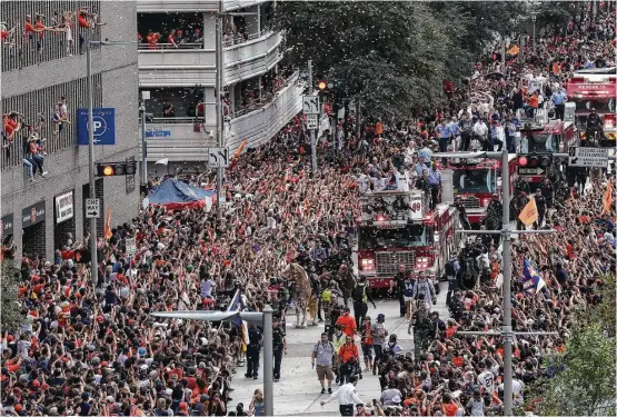  ?? Jon Shapley / Houston Chronicle ?? Officials estimated that 750,000 to a million fans packed the downtown streets for the Astros’ first World Series victory parade after 56 years of baseball in Houston.