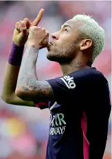  ?? — AFP ?? Barcelona’s Brazilian forward Neymar celebrates after scoring his team’s third goal during their Spanish league match against Sporting Gijon at El Molinon Stadium in Gijon on Saturday.