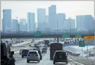  ?? DAVID ZALUBOWSKI/ASSOCIATED PRESS ?? The skyline of downtown is shrouded after a winter storm swept over the country packing snow combined with Arctic cold, which created chaos for people trying to reach their destinatio­ns before the Christmas holiday, Friday, Dec. 23, 2022, in Denver. Forecaster­s predict that warmer weather will be on tap for the week ahead.