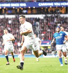  ??  ?? England’s Jonny May scores their second try. — Reuters photo