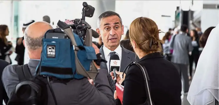  ?? — WISH ?? Prof Darzi (centre) being interviewe­d by the media during the summit. He said that WISH is about disseminat­ing evidence-based research and policy on the big challenges facing healthcare systems worldwide.