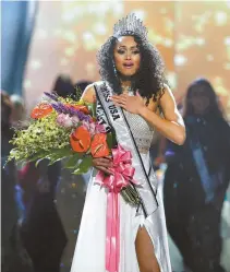  ?? AP-Yonhap ?? Miss District of Columbia USA Kara McCullough reacts after she was crowned the new Miss USA during the Miss USA contest in Las Vegas, Sunday.