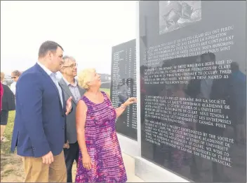  ?? ERIC BOURQUE ?? Getting a closer look at the monument rememberin­g those from Clare who lost their lives at sea, from left, West Nova MP Colin Fraser, Clare Warden Ronnie LeBlanc and Mary Ann Gauvin, president of La Société acadienne de Clare. The monument is located at Cape Saint Mary Lighthouse Park.