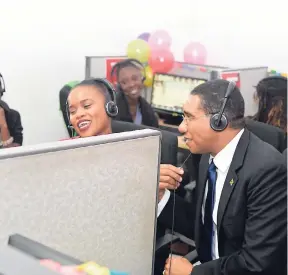  ?? FILE ?? In this 2016 file photo, Prime Minister Andrew Holness (seated right) gets first-hand informatio­n on business process outsourcin­g following a ground-breaking ceremony for the first of three Bioprist Knowledge Parks in Montego Bay.