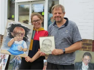  ??  ?? Arts trail artist Elizabeth Scales with her father James holding the portrait she created of him