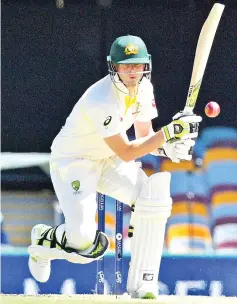  ?? — AFP photo ?? Australia’s batsman Steve Smith plays a shot on the second day of the first cricket Ashes Test between England and Australia in Brisbane on November 24, 2017.