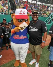  ?? SUBMITTED IMAGE ?? West End Little League President Ron Davis (right) with the Little League mascot on Aug. 19, 2017 during festivitie­s of the Little League World Series, where the team was presented a $15,000 grant from Dick’s Sporting Goods.