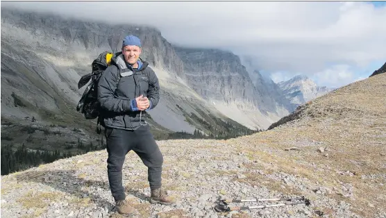  ?? PHOTOS: ANDREW PENNER ?? Drew Johnson on the summit of Three Sisters Pass on Heiko’s Trail.