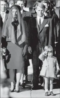  ??  ?? America mourned the death of President John F. Kennedy in 1963 during four straight days of TV coverage. Shown at his funeral Mass on Nov. 25, 1963, are (from left) Jacqueline Kennedy, Robert Kennedy and John F. Kennedy Jr.