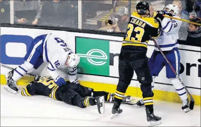  ?? AP PHOTO ?? Boston Bruins’ Zdeno Chara shoves Toronto Maple Leafs’ Nazem Kadri to retaliate for his late hit on teammate Tommy Wingels, bottom left, as Maple Leafs’ Mitchell Marner starts to get up during the third period of Game 1 of their NHL playoff series...