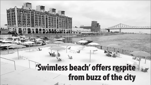  ?? — Photo by The Canadian Press ?? A new beach at Montreal’s Old Port is seen July 6.