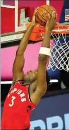  ?? The Associated Press ?? Toronto Raptors forward OG Anunoby dunks against the Brooklyn Nets on Friday in Lake Buena Vista, Fla.