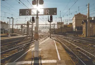  ?? AP-Yonhap ?? An empty train platform is pictured during a railway strike at the Lyon Perrache train station, central France, in this March 22 file photo. France’s national train company SNCF said in a statement Sunday warning that a workers’ strike will disrupt...