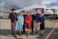  ??  ?? n PAST AND PRESENT: British Airways cabin crew, Laura Lanigan, Patricia Pearce, Bob Godfrey, Gillian Burrows, Trevor Lewis, Julie Thompson and Lucinda Starling, wearing the uniforms they wore when they had the honour of flying the Queen, on the runway...