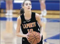  ?? MICHAEL GARD/POST-TRIBUNE ?? LaPorte’s Natalie Thiem looks to pass during a Jan. 9 game at Lake Central.