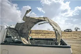  ?? SERGEY PONOMAREV/THE NEW YORK TIMES ?? Pieces of an Iranian missile in a pickup in Israel on Sunday. A source says Israel’s war Cabinet is committed to responding to Iran’s weekend missile attack — almost all of which was intercepte­d — but in ways that wouldn’t cause casualties.