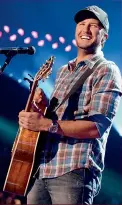  ??  ?? Works matters get a boost on the 5th and 6th for Cancers like Luke— focusing on your goal will help you succeed! Luke Bryan