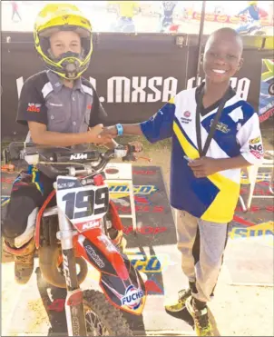  ??  ?? WELL DONE MATE . . . One of Zimbabwe’s top junior motocross riders Daiyaan “Dee” Manuel (left) being congratula­ted by compatriot Emmanuel Bako soon after he was crowned the 2017 65cc A Class Champion at the end of this year’s South African National...