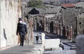  ?? The Associated Press ?? People walk in the archeologi­cal site of Pompeii during the inaugurati­on of the museum Antiquariu­m, in Pompeii, Italy, on Monday.