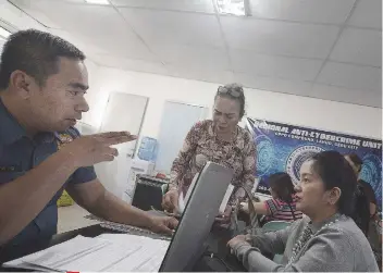  ?? SUNSTAR FOTO / AMPER L. CAMPAÑA ?? HELP. Businesswo­man Prisca Niña Mabatid seeks the help of the Philippine National Police Anti-Cybercrime Group in running after those who used her company’s name allegedly to dupe applicants for jobs abroad.