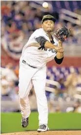  ?? BRYAN CEREIJO/TNS ?? Marlins starter Edison Volquez makes a pickoff attempt during his start on Monday night. He earned his first win of the season.